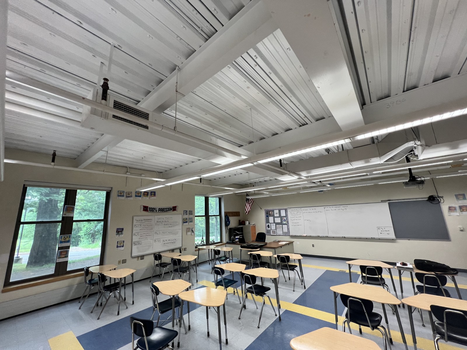 Bromfield classroom before treatment, with a bare metal deck ceiling